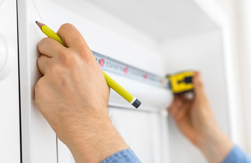 Use a metal tape measure to measure window blinds